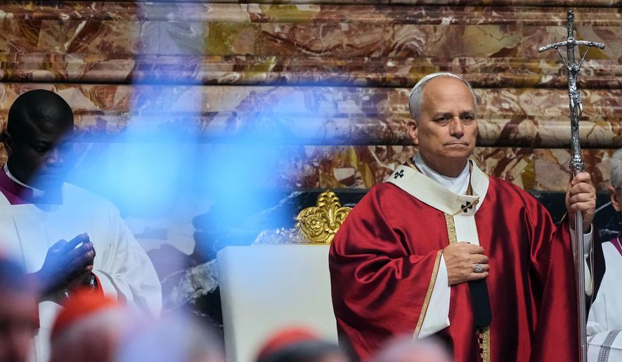 Pope Leo XIV arrives in St. Peter's Basilica at the Vatican for Mass for the repose of the soul of the late Pope Francis and deceased cardinals, Monday, Nov. 3, 2025. (AP Photo/Andrew Medichini), File)