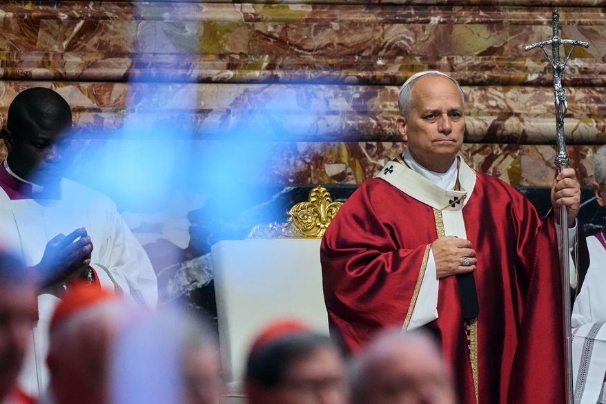 Pope Leo XIV arrives in St. Peter's Basilica at the Vatican for Mass for the repose of the soul of the late Pope Francis and deceased cardinals, Monday, Nov. 3, 2025. (AP Photo/Andrew Medichini), File)