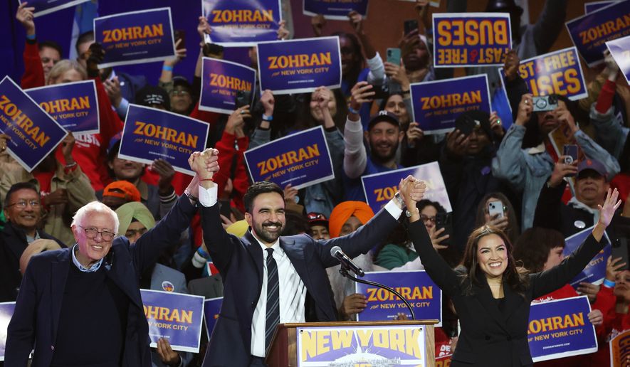 Sen. Bernie Sanders, I-Vt., left, New York City mayoral candidate Zohran Mamdani, center, and Rep. Alexandria Ocasio-Cortez, D-N.Y., appear on stage during a rally, Sunday, Oct. 26, 2025, in New York. (AP Photo/Heather Khalifa) **FILE**