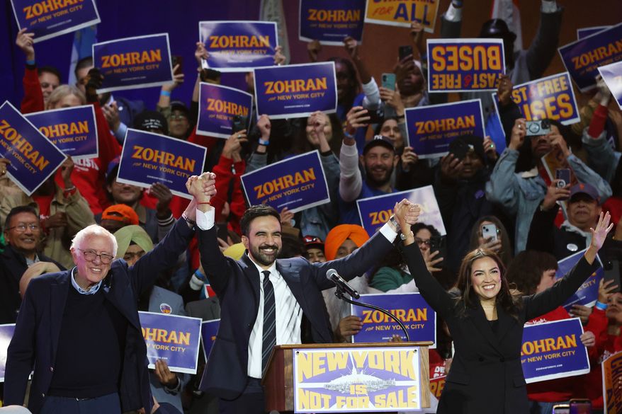 Sen. Bernie Sanders, I-Vt., left, New York City mayoral candidate Zohran Mamdani, center, and Rep. Alexandria Ocasio-Cortez, D-N.Y., appear on stage during a rally, Sunday, Oct. 26, 2025, in New York. (AP Photo/Heather Khalifa) **FILE**