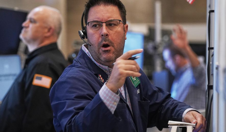 Options trader Andrew Longaro works on the floor of the New York Stock Exchange, Wednesday, Nov. 5, 2025. (AP Photo/Richard Drew)