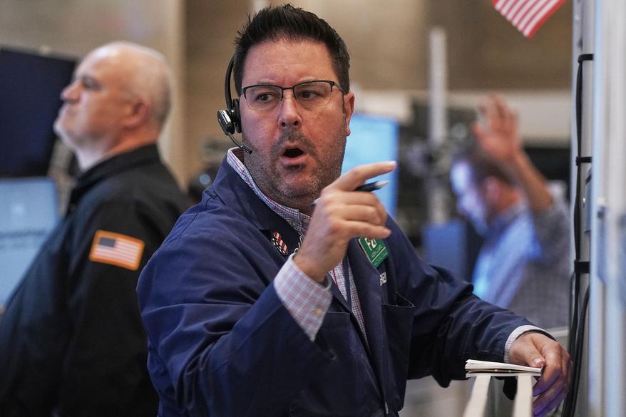 Options trader Andrew Longaro works on the floor of the New York Stock Exchange, Wednesday, Nov. 5, 2025. (AP Photo/Richard Drew)