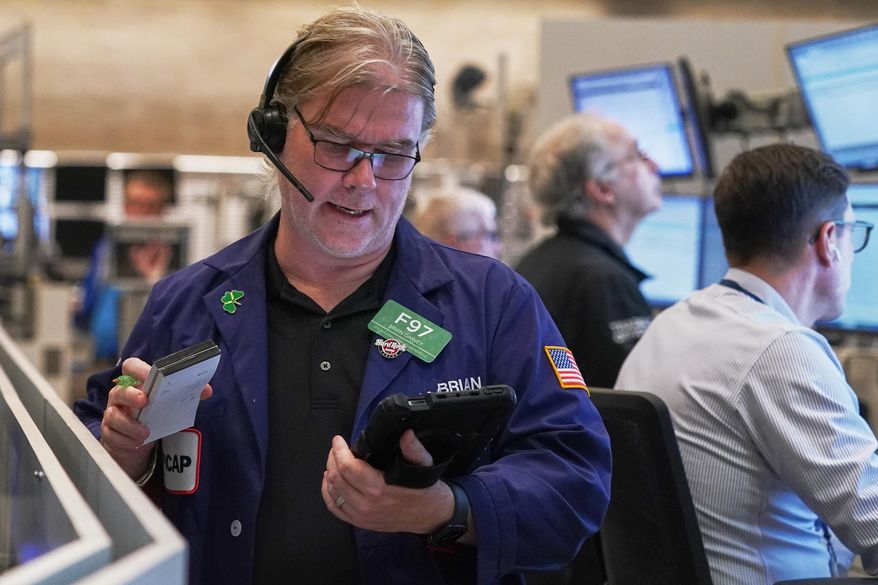 Options trader Brian Garvey works on the floor of the New York Stock Exchange, Thursday, Nov. 6, 2025. (AP Photo/Richard Drew)