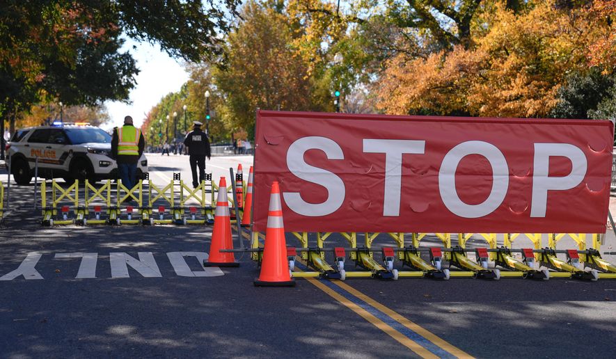 The roadway in front of the Supreme Court and U.S. Capitol is closed to traffic on the 36th day of the government shutdown on Capitol Hill, Wednesday, Nov. 5, 2025, in Washington. (AP Photo/Mariam Zuhaib)