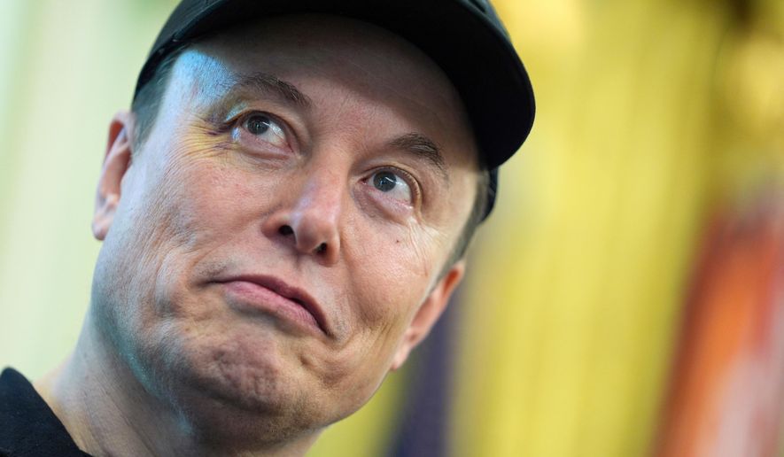 Elon Musk listens as President Donald Trump speaks during a news conference in the Oval Office of the White House, May 30, 2025, in Washington. (AP Photo/Evan Vucci, File)