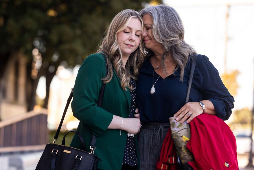 Abby Zwerner shares a moment with her mother Julie Zwerner after a verdict was reached in her lawsuit against the assistant principal, Ebony Parker, of Richneck Elementary School during proceedings at Newport News Circuit Court in Newport News, Va. on Thursday, Nov. 6, 2025. (Kendall Warner/The Virginian-Pilot via AP)