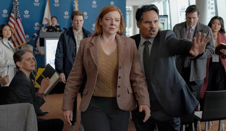 This image released by Peacock shows Sarah Snook, center, and Michael Peña, right, in a scene from "All Her Fault." (Sarah Enticknap/Peacock via AP)