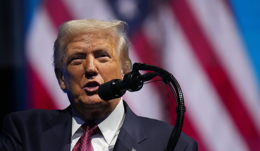 President Donald Trump speaks to the America Business Forum Miami, at the Kaseya Center, Wednesday, Nov. 5, 2025, in Miami. (AP Photo/Jacquelyn Martin)