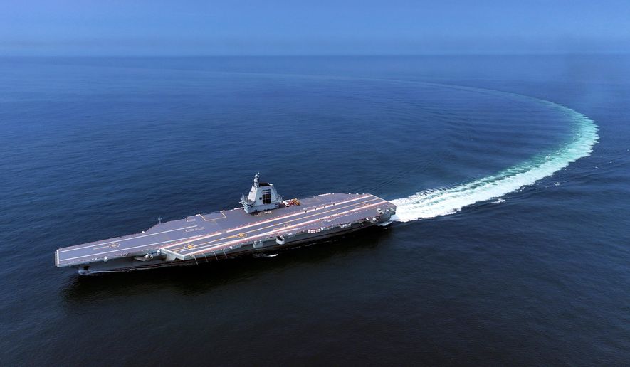 In this photo released by Xinhua News Agency, China's third conventionally powered aircraft carrier, the Fujian, conducts a maiden sea trial on May 7, 2024. (Ding Ziyu/Xinhua via AP, File)
