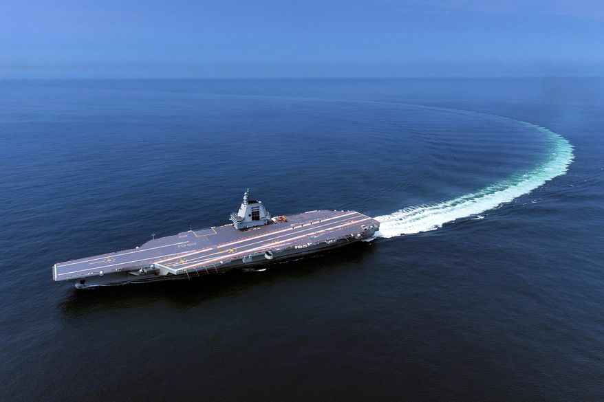In this photo released by Xinhua News Agency, China's third conventionally powered aircraft carrier, the Fujian, conducts a maiden sea trial on May 7, 2024. (Ding Ziyu/Xinhua via AP, File)