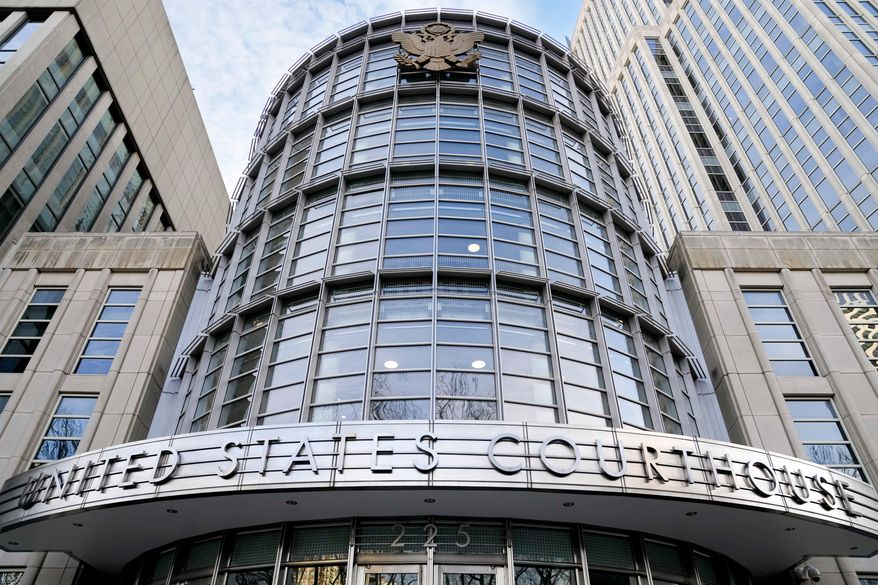FILE - The seal of the United States is displayed on the facade of Federal court in Brooklyn, Jan. 17, 2023, in New York. (AP Photo/John Minchillo, File)