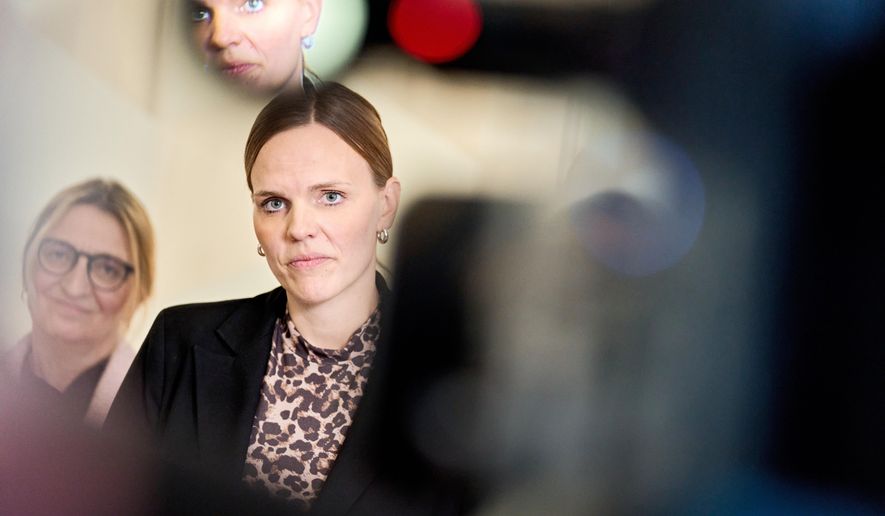 Caroline Stage, Danish Minister for Digitalization and representatives from the agreement parties attends a press conference about a new political agreement for better protection of children and young people online, in Copenhagen, Friday, Nov. 7, 2025. (Thomas Traasdahl/Ritzau Scanpix via AP)