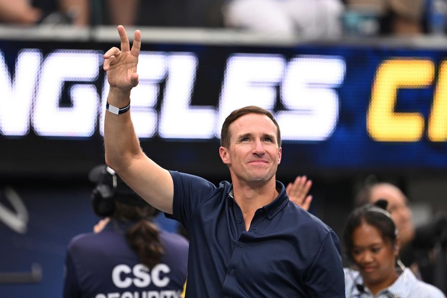 FILE - Former quarterbackDrew Brees waves to the crowd during the first half of an NFL football game between the Los Angeles Chargers and the Denver Broncos, Sunday, Sept. 21, 2025, in Inglewood, Calif. (AP Photo/Carrie Giordano, File)