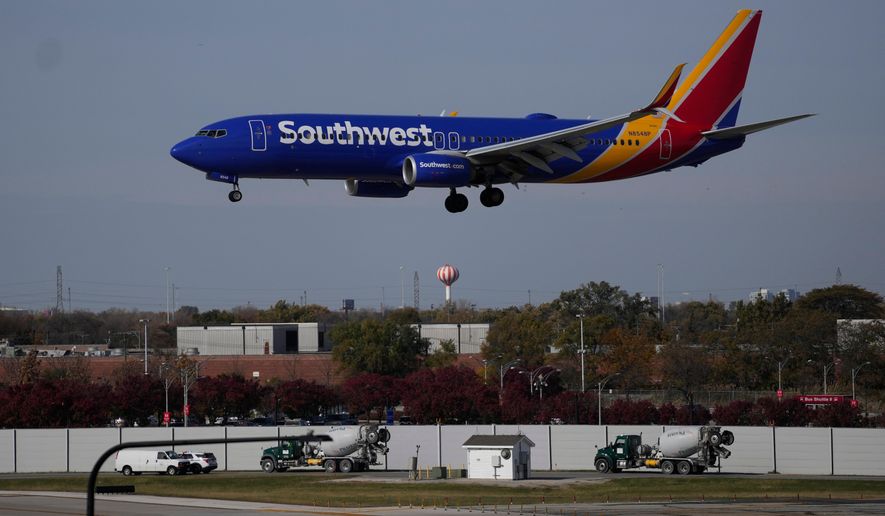 A Southwest Airlines airplane lands at Midway International Airport, Thursday, Nov. 6, 2025, in Chicago. (AP Photo/Erin Hooley)