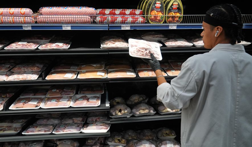 A grocery store meat handler stocks poultry, which is covered by the USDA Supplemental Nutrition Assistance Program (SNAP) at a grocery store in Baltimore on Thursday, Oct. 30, 2025. (AP Photo/Stephanie Scarbrough) **FILE**