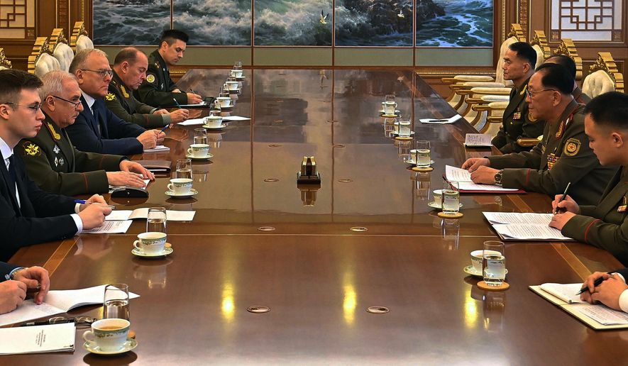 In this photo provided by North Korean government, Russian Vice Defense Minister Viktor Goremykin, second left, meets North Korean Defense Minister No Kwang Chol, second right, at an undisclosed place in North Korea Thursday, Nov. 6, 2025. Independent journalists were not given access to cover the event depicted in this image distributed by the North Korean government. The content of this image is as provided and cannot be independently verified. (Korean Central News Agency/Korea News Service via AP)