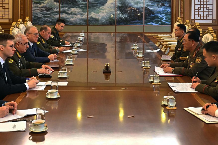 In this photo provided by North Korean government, Russian Vice Defense Minister Viktor Goremykin, second left, meets North Korean Defense Minister No Kwang Chol, second right, at an undisclosed place in North Korea Thursday, Nov. 6, 2025. Independent journalists were not given access to cover the event depicted in this image distributed by the North Korean government. The content of this image is as provided and cannot be independently verified. (Korean Central News Agency/Korea News Service via AP)