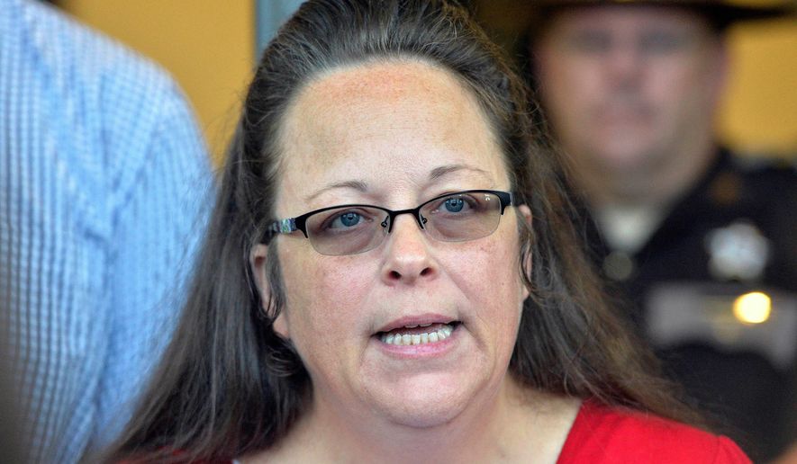 Rowan County Clerk Kim Davis makes a statement to the media at the front door of the Rowan County Judicial Center in Morehead, Ky., on Sept. 14, 2015. (AP Photo/Timothy D. Easley, File)