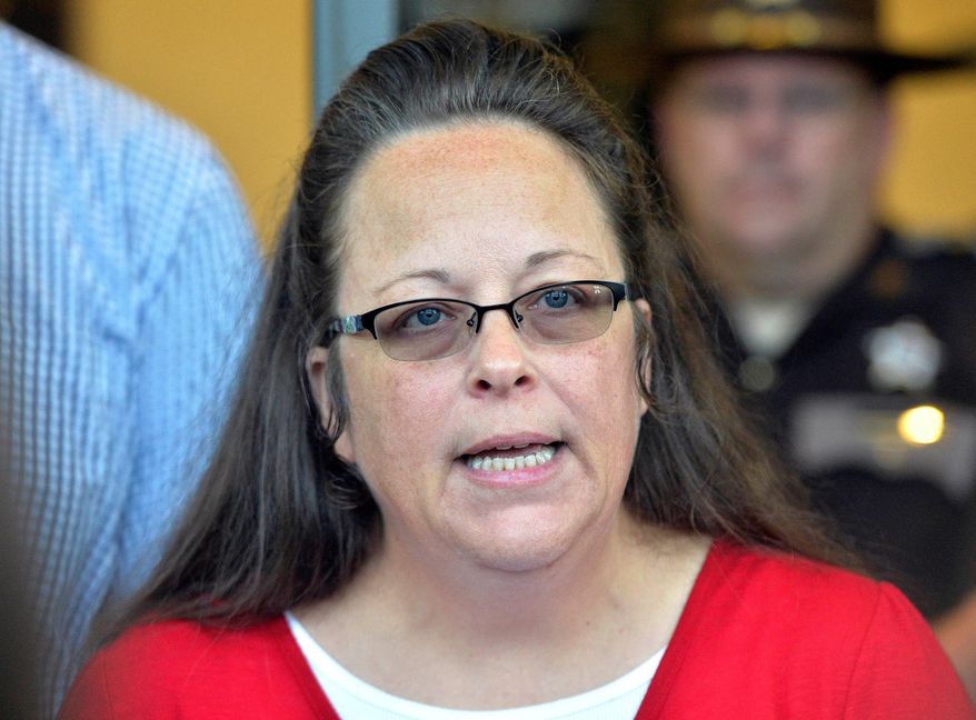 Rowan County Clerk Kim Davis makes a statement to the media at the front door of the Rowan County Judicial Center in Morehead, Ky., on Sept. 14, 2015. (AP Photo/Timothy D. Easley, File)