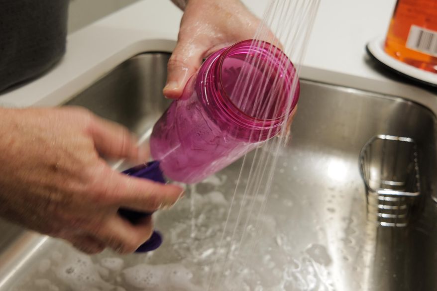 A reusable water bottle is washed in New York on Thursday, Oct. 16, 2025. (AP Photo/Patrick Sison)