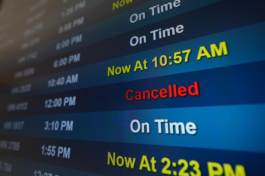 A flight is listed as cancelled on a display at San Diego International Airport Saturday, Nov. 8, 2025, in San Diego. (AP Photo/Gregory Bull)