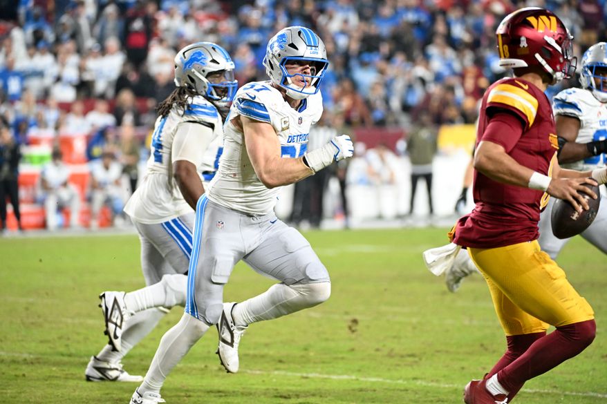 Detroit Lions defensive end Aidan Hutchinson (97) chasing after Washington Commanders quarterback Marcus Mariota (8) during the 2nd half of an NFL game at Northwest Stadium in Landover, MD, November 9, 2025. (Photo for the Washington Times)