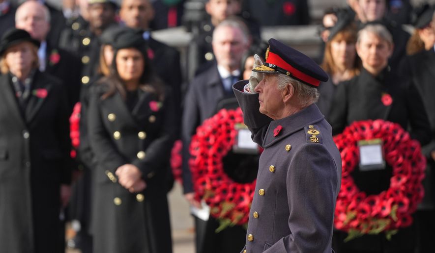 Britain's King Charles III salutes as he attends the Remembrance Sunday Service at the Cenotaph in London, Sunday, Nov. 9, 2025.(AP Photo/Alastair Grant, Pool)