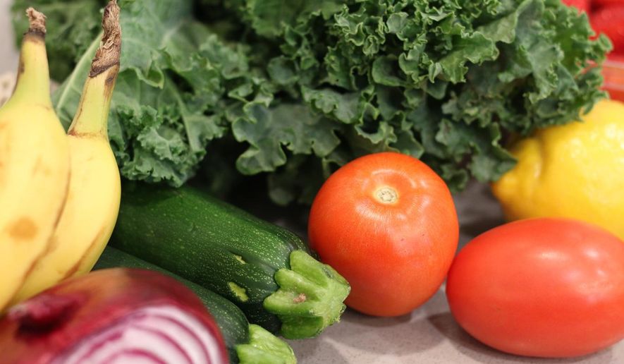 Groceries lay on a kitchen counter before being sorted for storage in the pantry and refrigerator Oct. 25, 2025, in Flagstaff, Ariz. (AP Photo/Cheyanne Mumphrey)