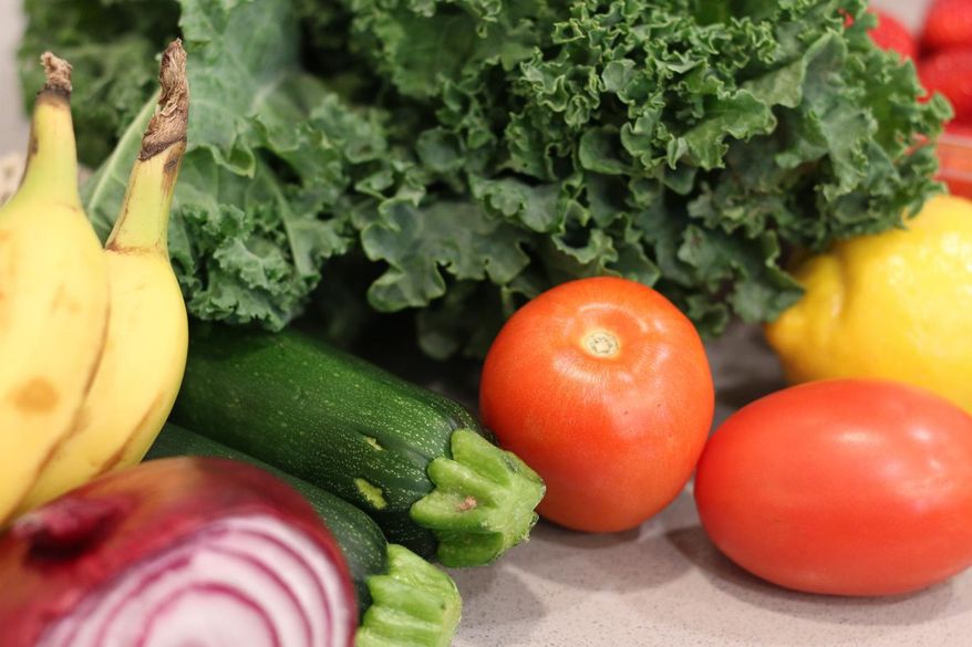Groceries lay on a kitchen counter before being sorted for storage in the pantry and refrigerator Oct. 25, 2025, in Flagstaff, Ariz. (AP Photo/Cheyanne Mumphrey)