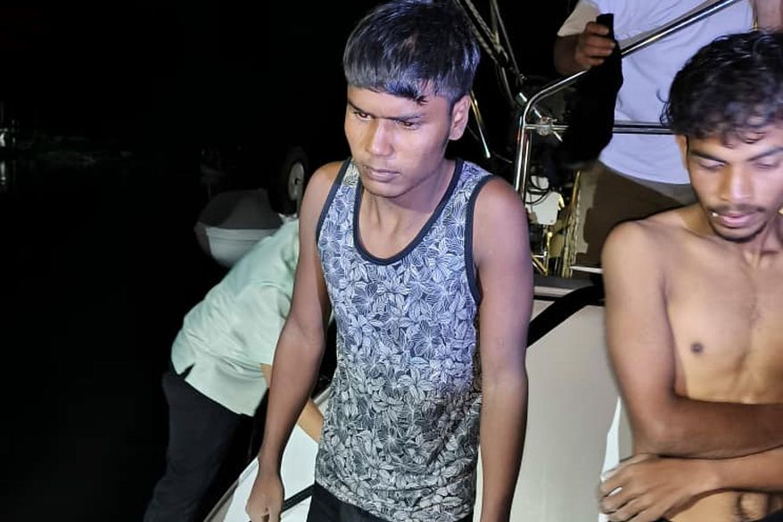 This photo released by Malaysian Maritime Enforcement Agency shows migrants handed over to authorities after they were rescued by a sailboat, in waters off northern resort island of Langkawi, Malaysia, Saturday, Nov. 8, 2025. (Malaysian Maritime Enforcement Agency via AP)