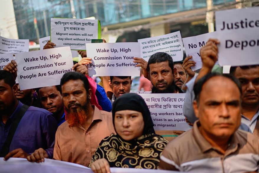 Bangladeshi workers who were employed by Malaysian companies protest in front of the Ministry of Expatriates' Welfare and Overseas Employment demanding unpaid wages, fair compensation and an end to alleged abuse by Malaysian employers, in Dhaka, Bangladesh, Monday, Nov. 10, 2025. (AP Photo/Mahmud Hossain Opu)