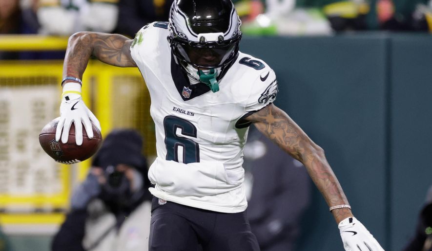 Philadelphia Eagles wide receiver DeVonta Smith (6) celebrates after scoring a touchdown against the Green Bay Packers during the second half of an NFL football game Monday, Nov. 10, 2025, in Green Bay, Wis. (AP Photo/Matt Ludtke)