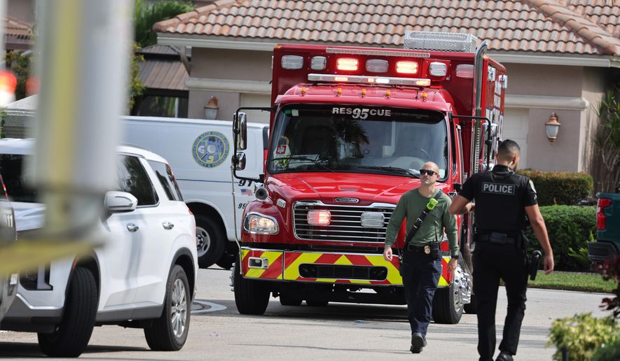 Emergency personnel from Coral Springs and Coconut Creek are on scene where a plane crashed in the Windsor Bay community in Coral Springs on Monday, Nov. 10, 2025. (Carline Jean/South Florida Sun-Sentinel via AP)