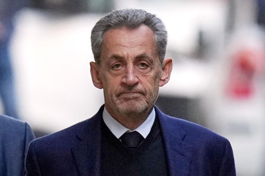 Former French President Nicolas Sarkozy leaves his home Tuesday, Oct. 21, 2025 in Paris as he heads to prison to serve time for a criminal conspiracy to finance his 2007 election campaign with funds from Libya. (AP Photo/Thibault Camus, File)