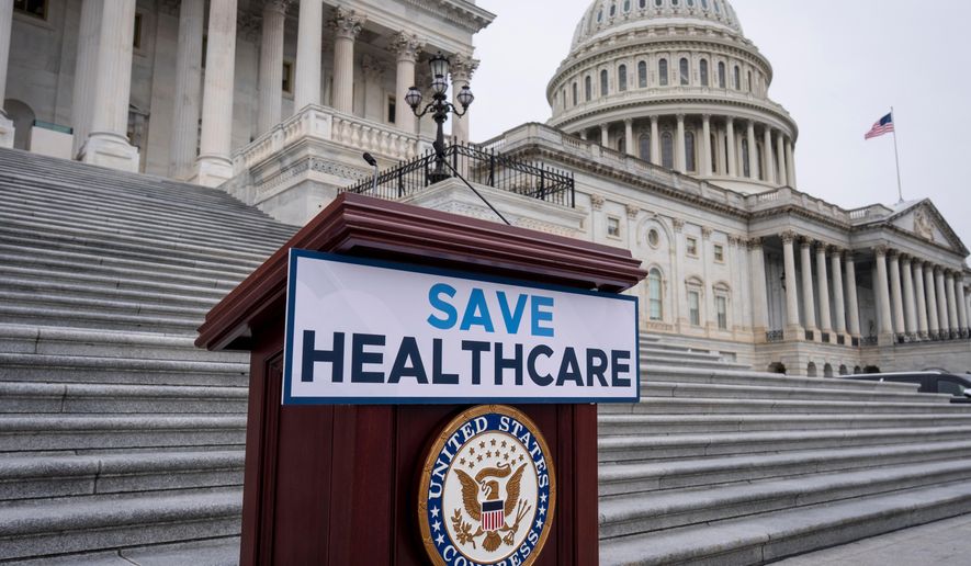 FILE - House Democrats prepare to speak on the steps of the Capitol to insist that Republicans include an extension of expiring health care benefits as part of a government funding compromise, in Washington, Sept. 30, 2025. (AP Photo/J. Scott Applewhite, File)