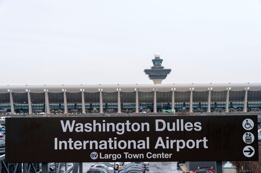 A sign of Washington Dulles International Airport station is seen during the opening of new Silver Line Extension at Washington Dulles International Airport, in Chantilly, Va., Nov. 15, 2022. (AP Photo/Jose Luis Magana, File)