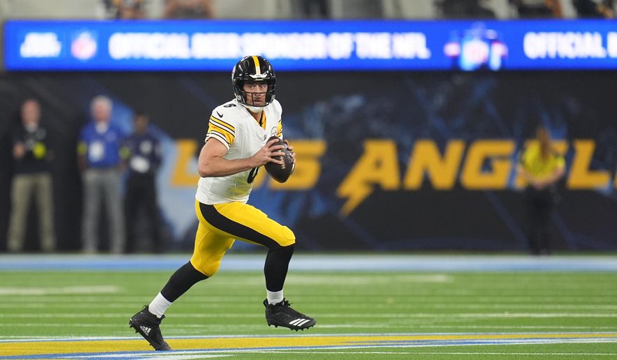 Pittsburgh Steelers quarterback Aaron Rodgers (8) pulls back to throw a pass during the first half of an NFL football game against the Los Angeles Chargers Sunday, Nov. 9, 2025, in Inglewood, Calif. (AP Photo/Marcio Jose Sanchez)
