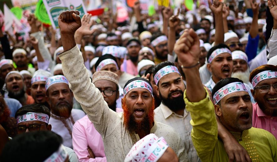Supporters of Bangladesh's Jamaat-e-Islami and seven allied political parties shout slogans during a rally to present their demands before the next general election, expected to be held in February, in Dhaka, Bangladesh, Tuesday, Nov. 11, 2025. (AP Photo/Mahmud Hossain Opu)