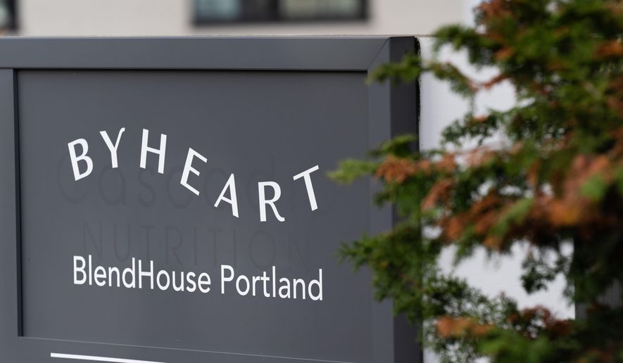 A sign for ByHeart, a manufacturer of organic baby formula, is displayed outside a building that houses a plant for the company on Tuesday, Nov. 11, 2025, in Portland, Ore. (AP Photo/Jenny Kane)