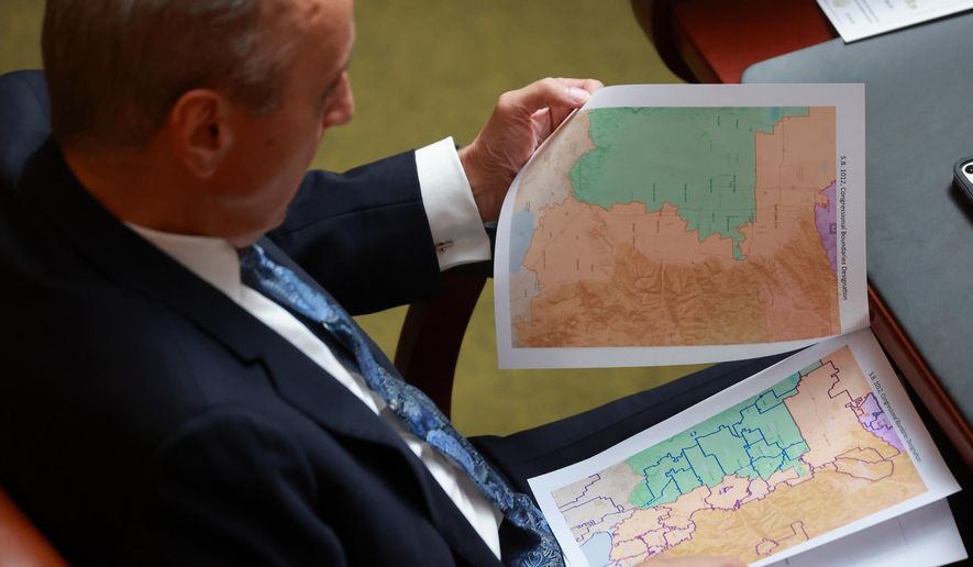 Rep. Cory Maloy, R-Lehi, holds a packet of potential redistricting maps as SB1012 Congressional Boundaries Designation is discussed in the House chamber during a special session at the Capitol on Monday, Oct. 6, 2025, in Salt Lake City. (Kristin Murphy/The Deseret News via AP, File)