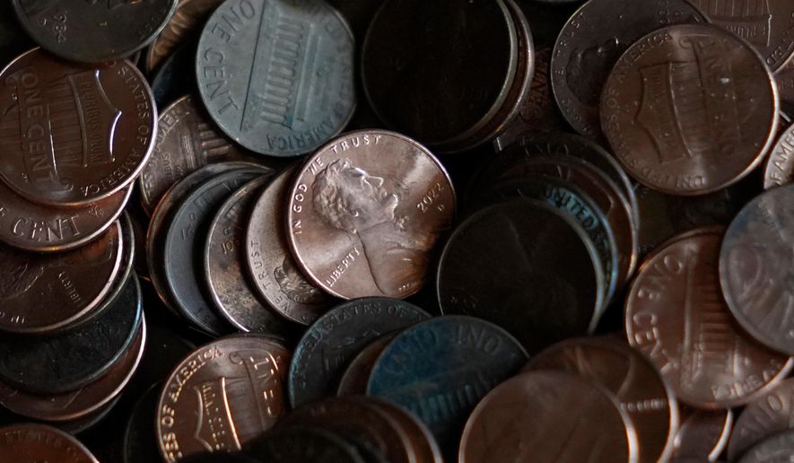 FILE - Pennies are piled up Feb. 10, 2025, in Richardson, Texas. (AP Photo/LM Otero, File)