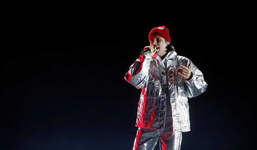FILE - French singer Aurelien Cotentin, known as Orelsan, performs on stage during the 34th Victoires de la Musique, the annual French music awards ceremony, in Paris, Friday, Feb. 8, 2019. (AP Photo/Thibault Camus, file)