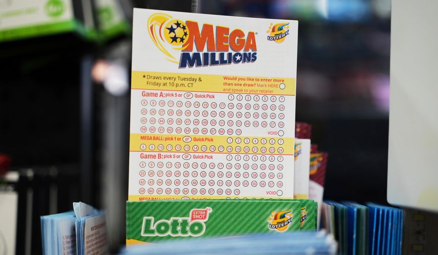 Mega Millions Lottery play slips are displayed for customers at a convenience store in Chicago, Sunday, April 6, 2025. (AP Photo/Nam Y. Huh, File)