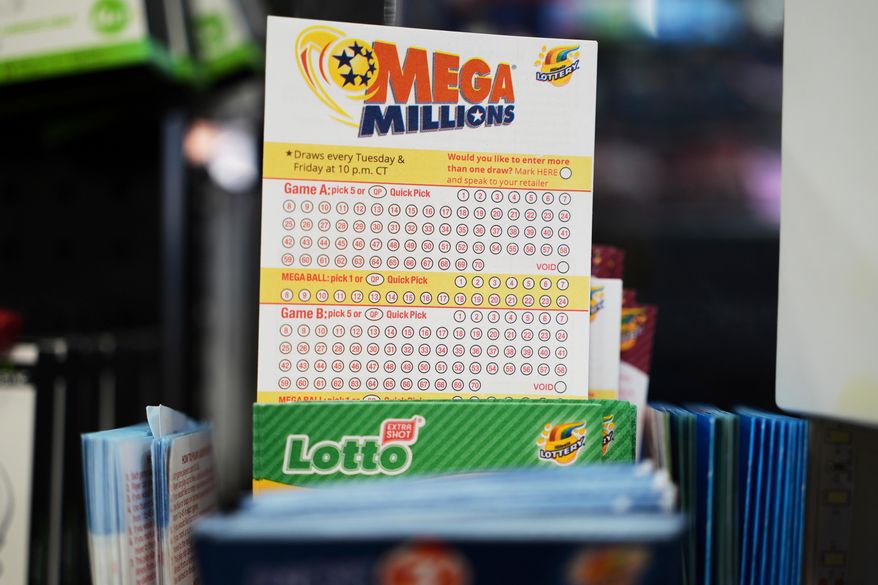 Mega Millions Lottery play slips are displayed for customers at a convenience store in Chicago, Sunday, April 6, 2025. (AP Photo/Nam Y. Huh, File)
