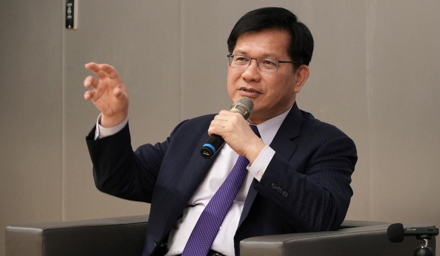 Taiwan's Foreign Minister Lin Chia-Lung speaks to reporters in Taipei city in Taiwan on Wednesday, Nov. 12, 2025. (AP Photo/Johnson Lai)