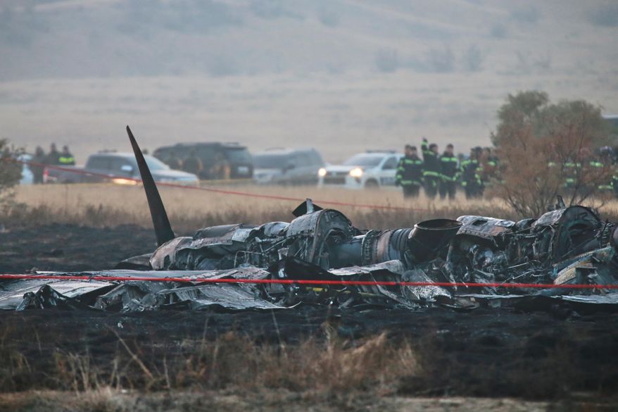 Debris is seen at a crash site of a Turkish military cargo plane in Georgia's Sighnaghi municipality, close to the Azerbaijani border on Wednesday, Nov. 12, 2025. (AP Photo/Zurab Tsertsvadze)