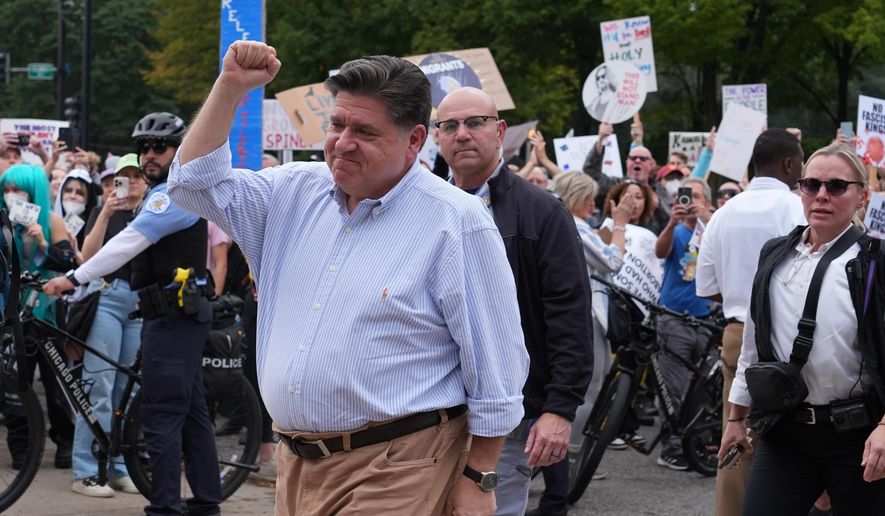 Illinois Gov. JB Pritzker, arrives during a "No Kings" protest Saturday, Oct. 18, 2025, in Chicago. (AP Photo/Nam Y. Huh)