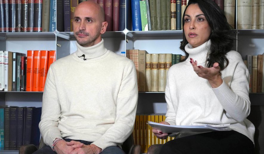 Silvia Carlucci, right, and Domenico Fabiani, two employees who were fired by the Vatican Bank in October 2024, after their wedding violated a ban on workplace marriage attend an interview with The Associated Press in Rome, Monday, Jan. 27, 2025. (AP Photo/Alessandra Tarantino, File)
