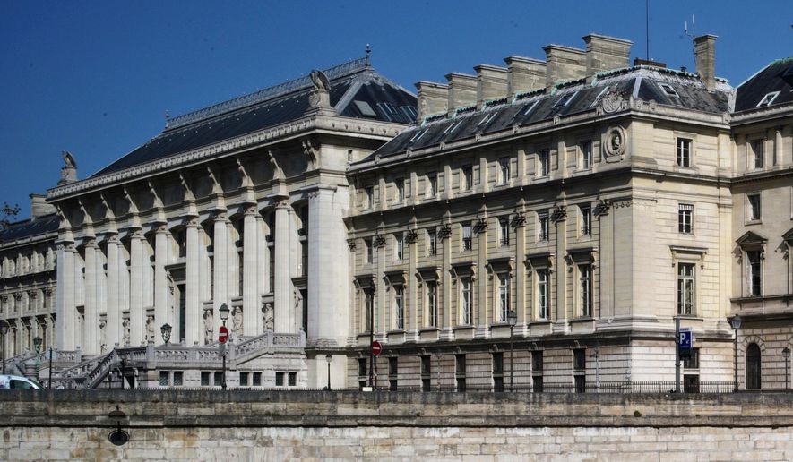 FILE - The Palais de Justice courthouse during nationwide confinement measures to counter the Covid-19, in Paris, Wednesday, April 8, 2020. (AP Photo/Thibault Camus, file)