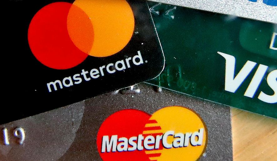 FILE - In this Feb. 20, 2019, file photo are Mastercard and Visa credit cards in Zelienople, Pa. (AP Photo/Keith Srakocic, File)